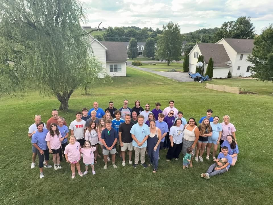 Caden's Crew gathered together outdoors